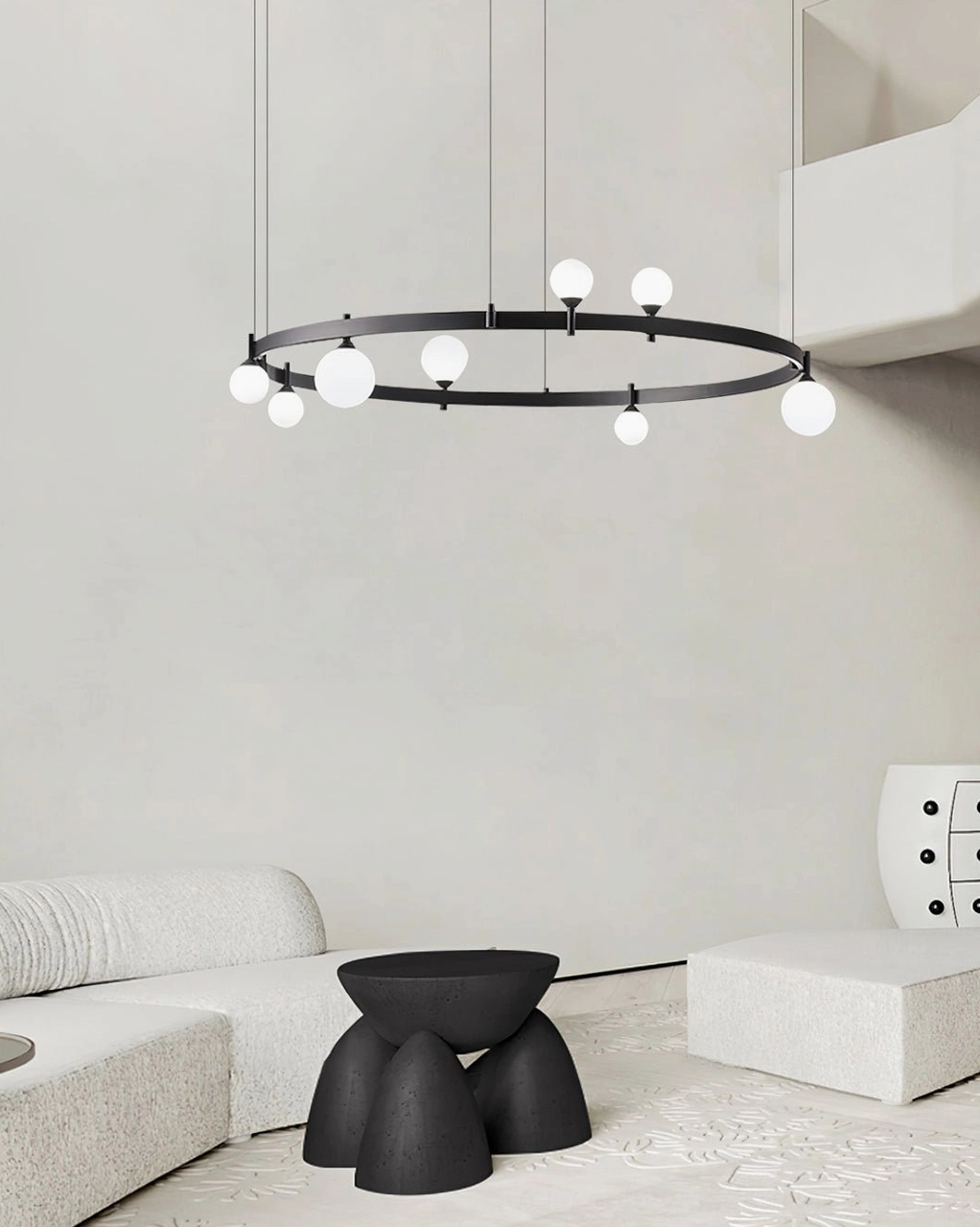 Circular modern chandelier installed above dining table in contemporary home with geometric minimalist styling