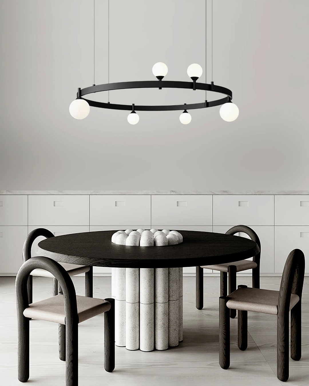 Stant circular orbital light installed in bedroom ceiling creating sculptural focal point with warm diffused light