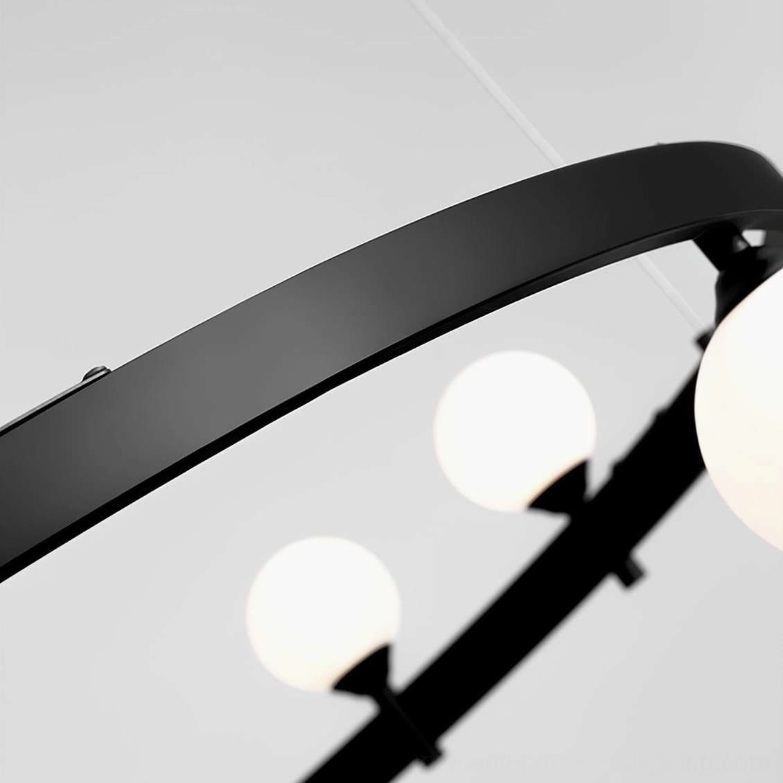 Modern circular pendant light installation view showcasing vertical hanging cords and horizontal ring geometry