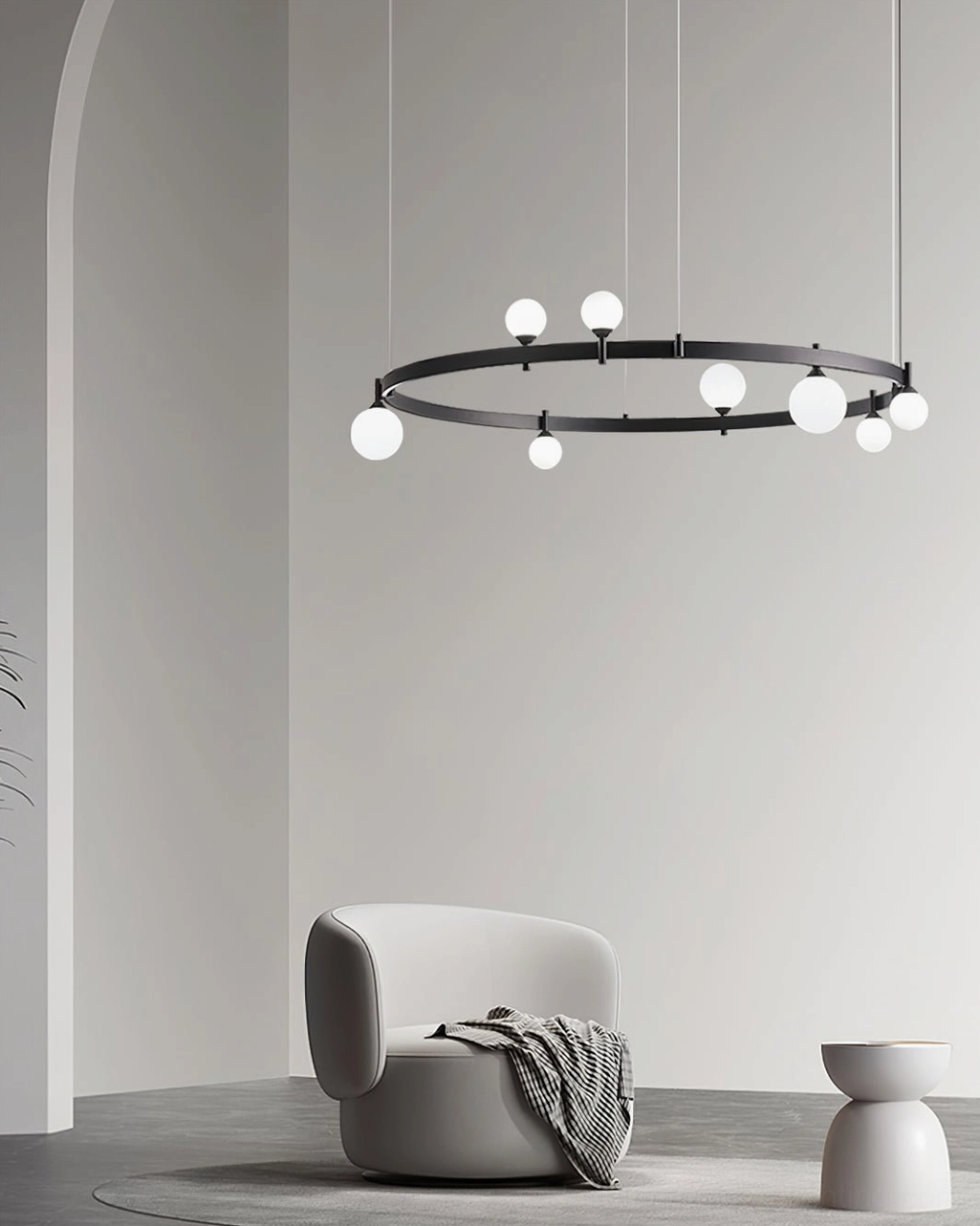 Sleek circular pendant light low side angle view showcasing matte black metal frame and frosted white globes