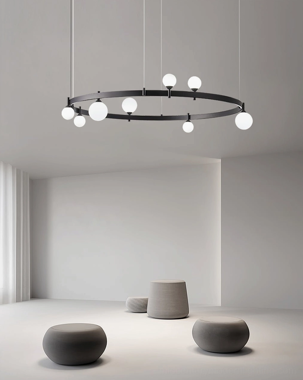 Circular globe pendant light frontal eye-level view in empty minimalist studio with thin suspension cords
