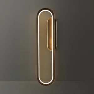 Vertical elongated oval LED wall lamp mounted on dark gray interior wall showing modern minimalist design