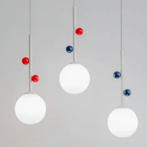 Set of three Stax pendant lamps displayed together showing multiple color variations, overhead studio view