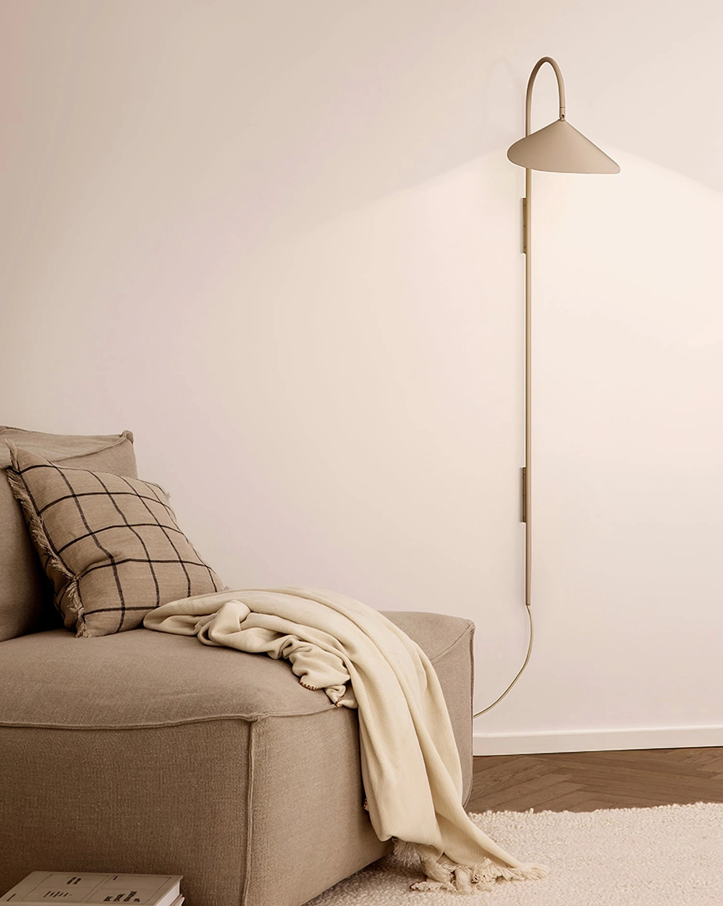 Compact Stella wall lamp flanking console table in entryway with minimalist modern decor