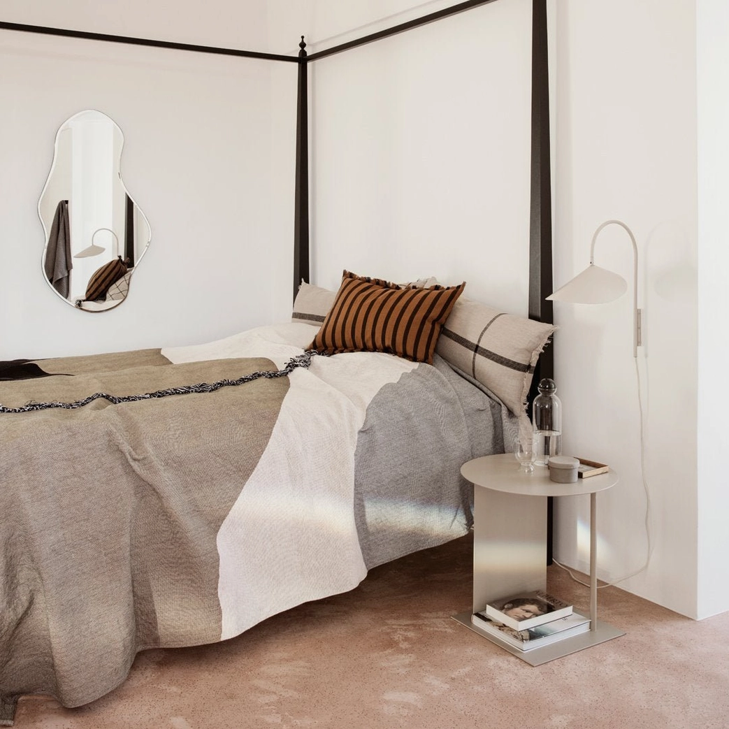 Mid-century modern Stella wall lamp in black integrated into contemporary living room design