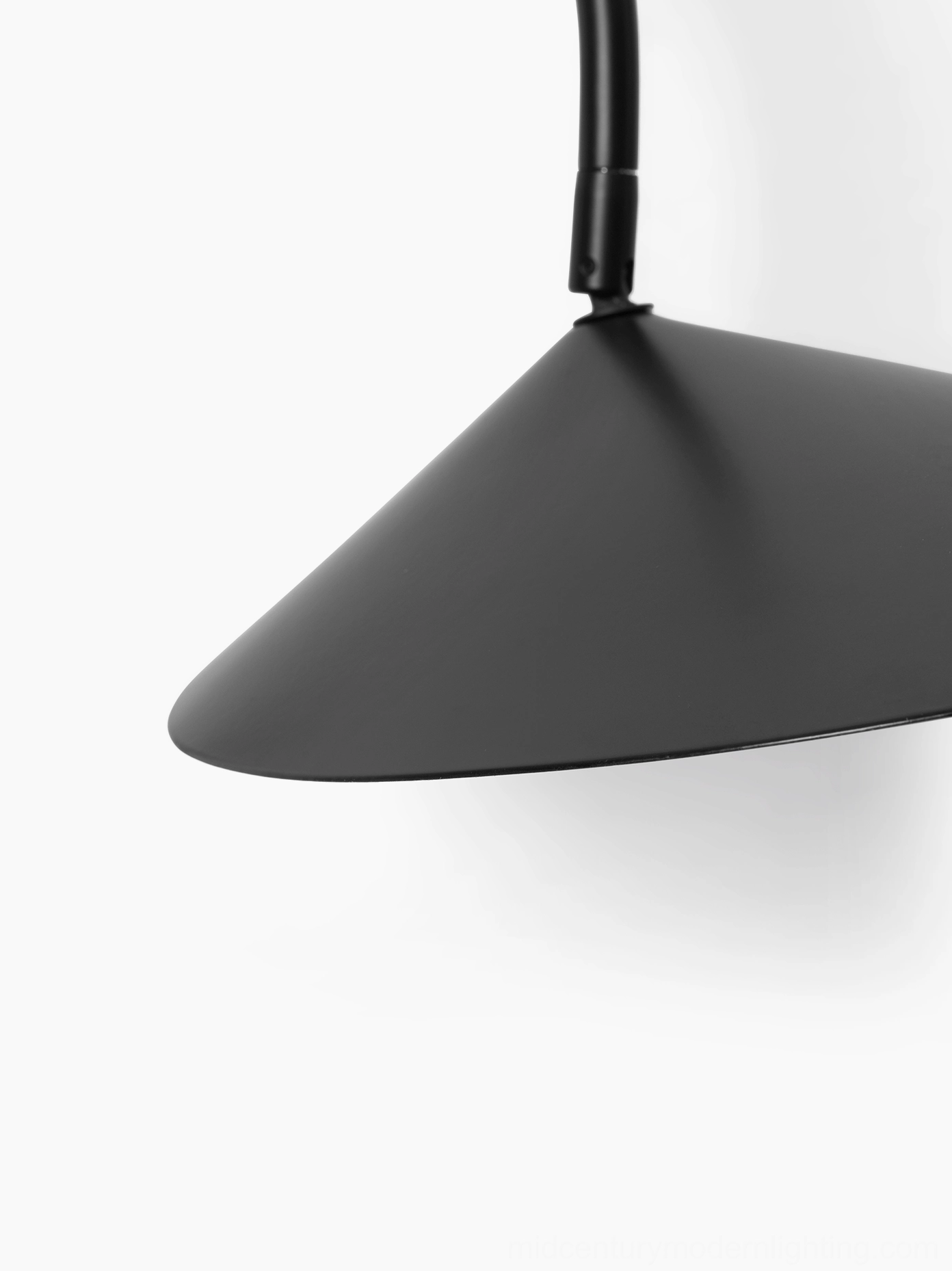 Stella wall lamp showing architectural metal silhouette and vertical light-wash effect