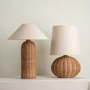 Two sizes of Stellan rattan table lamps displayed side by side, demonstrating compact and standard sizing options