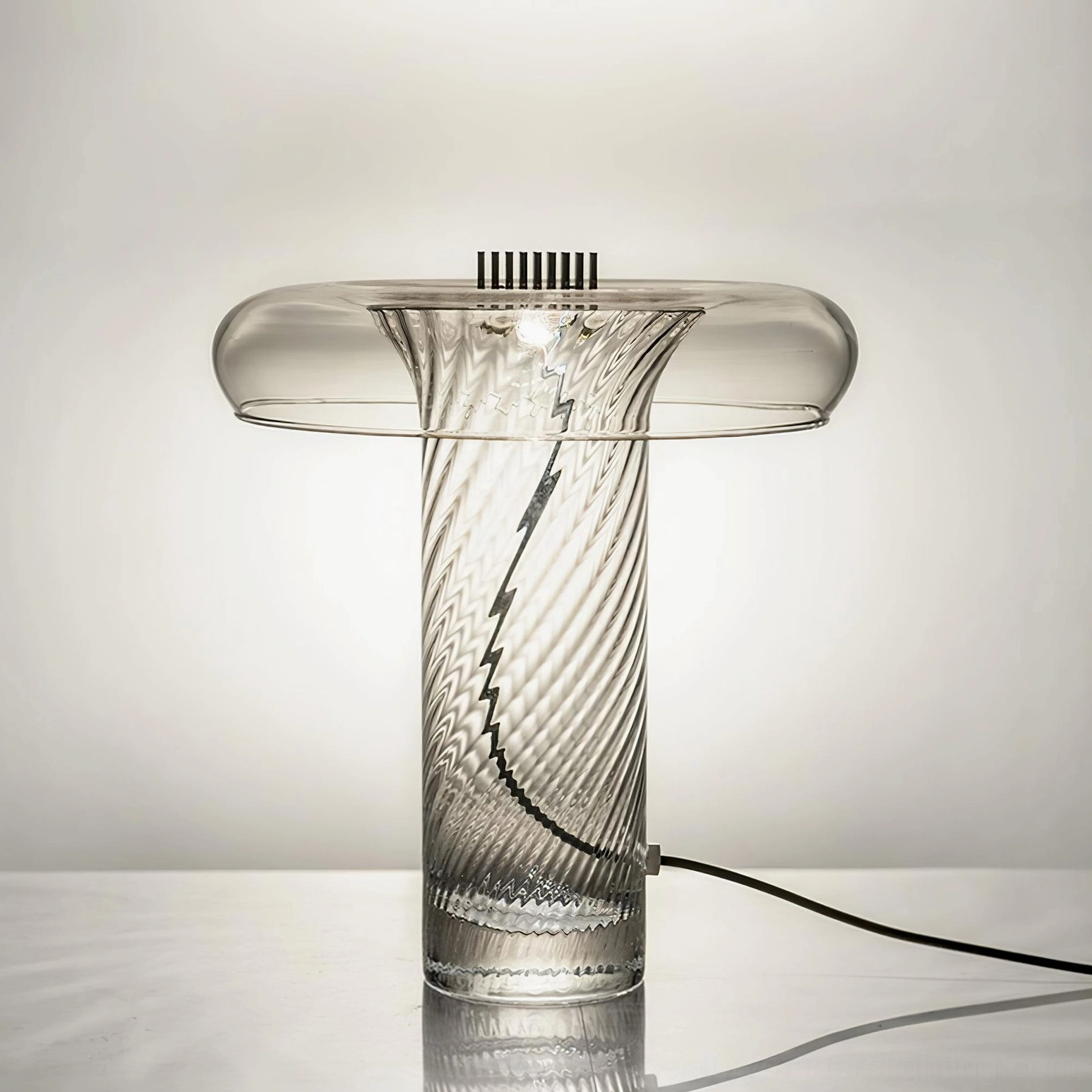 Stellar table lamp front-angled view showcasing wide ribbed glass shade and twisted texture detail