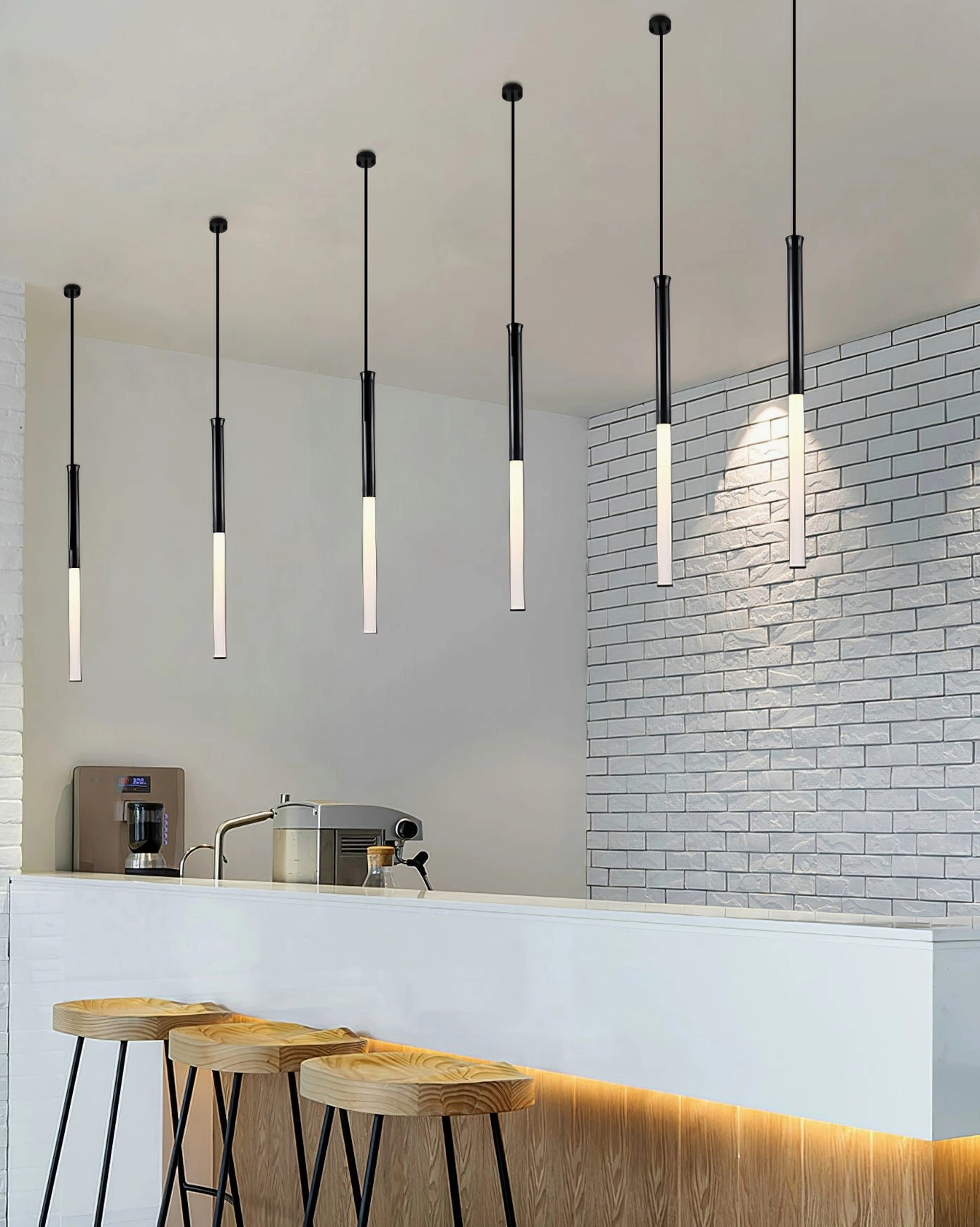 Six Stick LED pendant lights aligned over service counter in contemporary restaurant bar setting