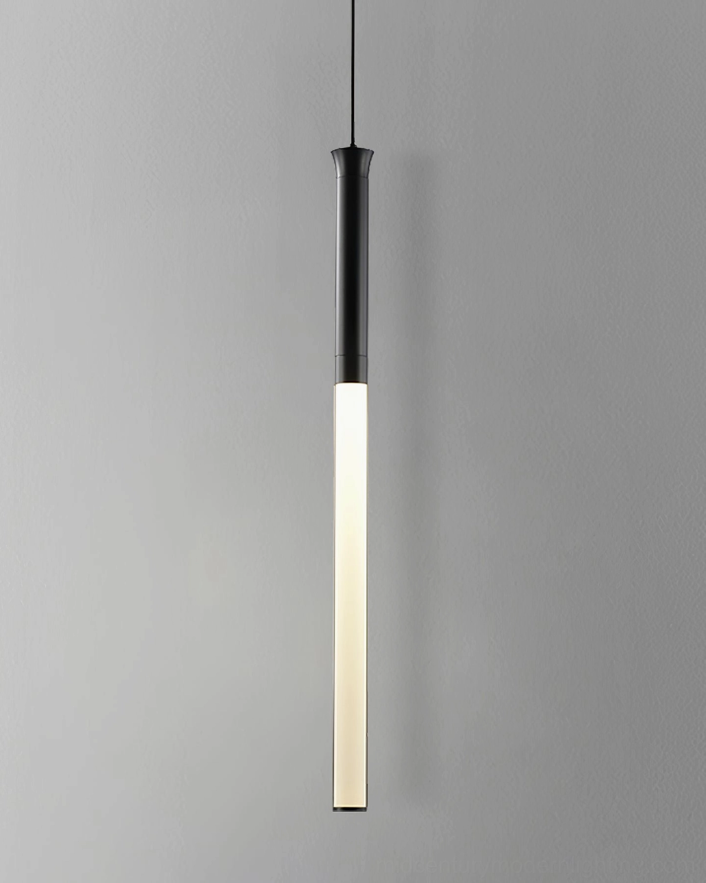 Clustered Stick LED pendants at staggered heights creating minimalist dining room lighting design