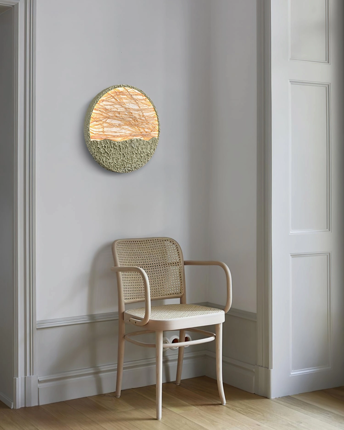 Straw wall lamp installed in bedroom corridor with rattan armchair and light wood frame furniture pairing