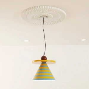 Yellow and blue striped mid-century modern pendant light installed on residential ceiling with decorative medallion and recessed downlights