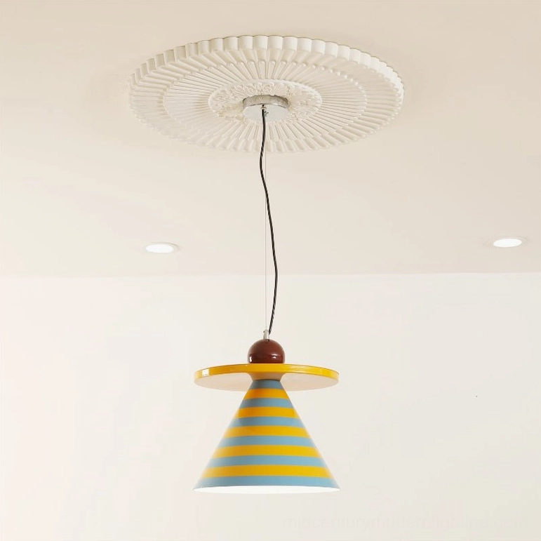 Yellow and blue striped mid-century modern pendant light installed on residential ceiling with decorative medallion and recessed downlights