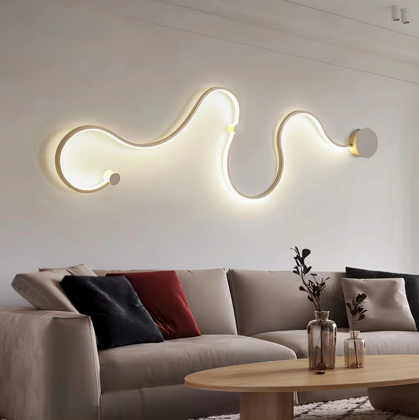 Style A sculptural snake wall lighting with elegant undulating curves in matte black