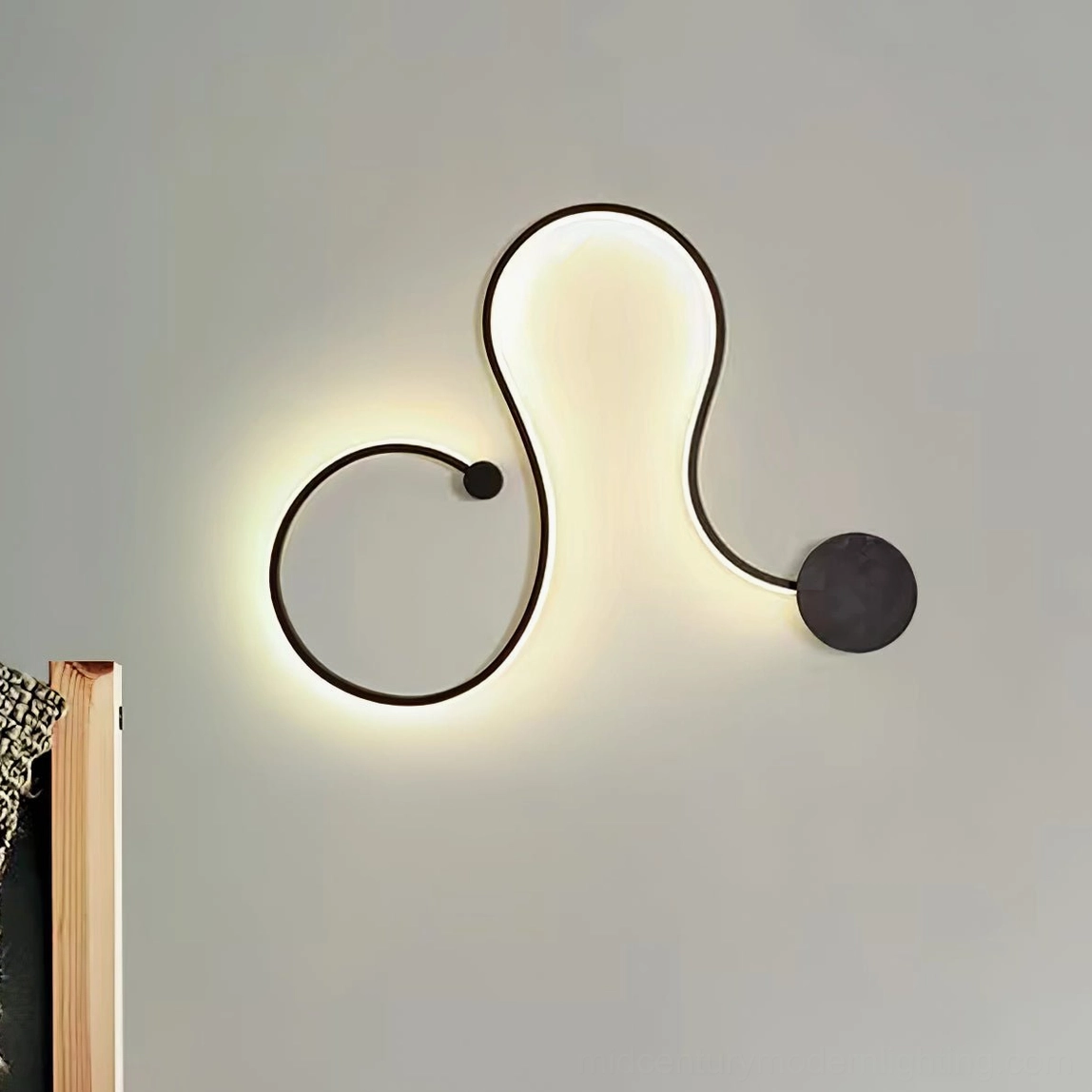 Style A white snake wall sconce with fluid modern design mounted on wall