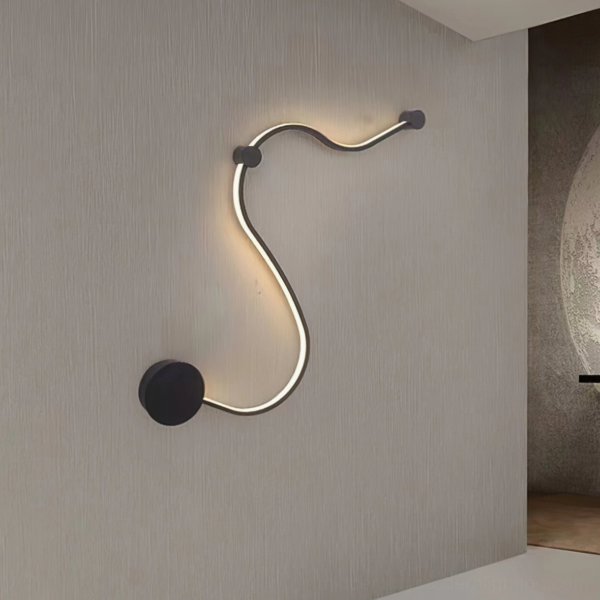Style C snake wall sconce mounted on accent wall providing artistic sculptural lighting