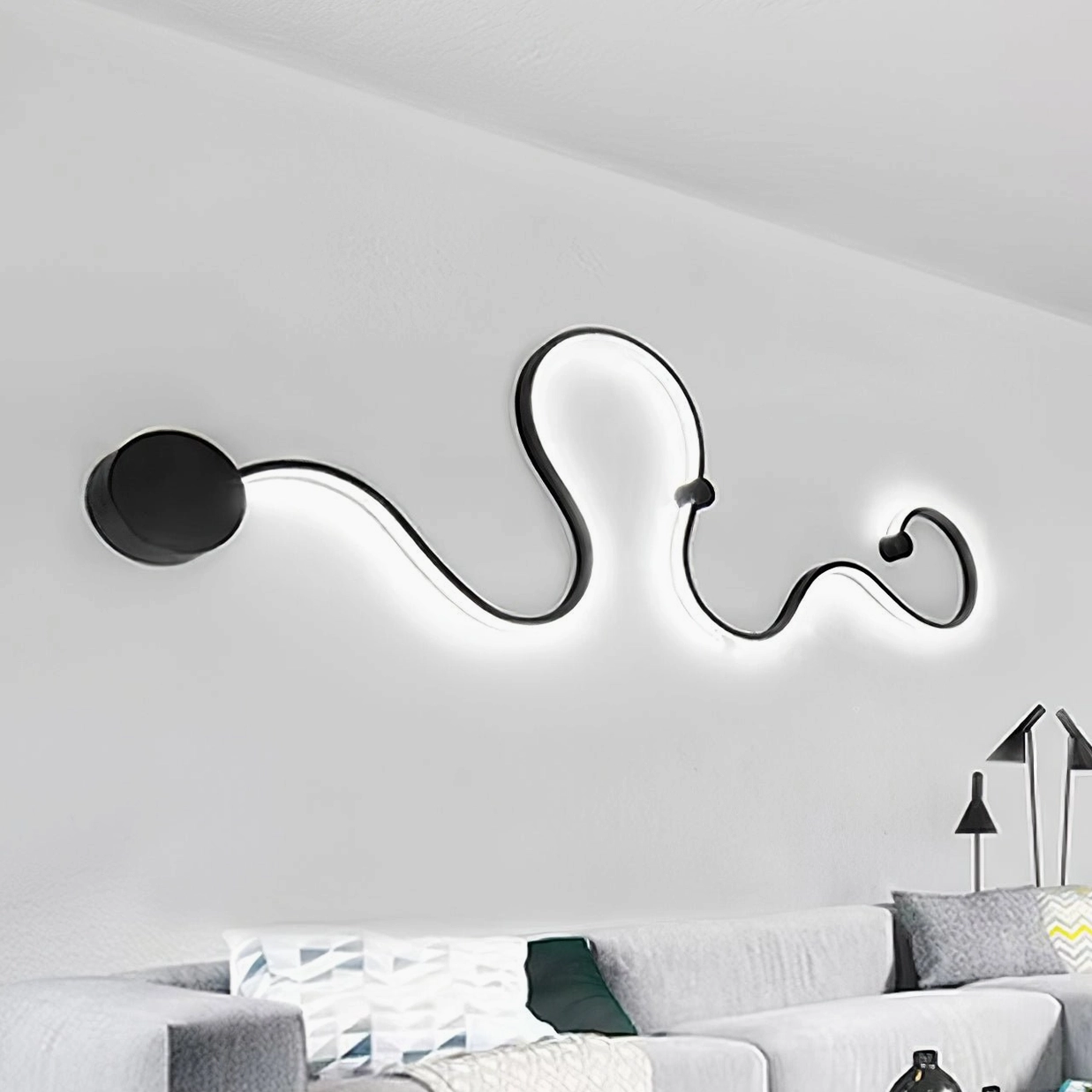 Style D snake wall lamp installation showing warm light version in contemporary bedroom