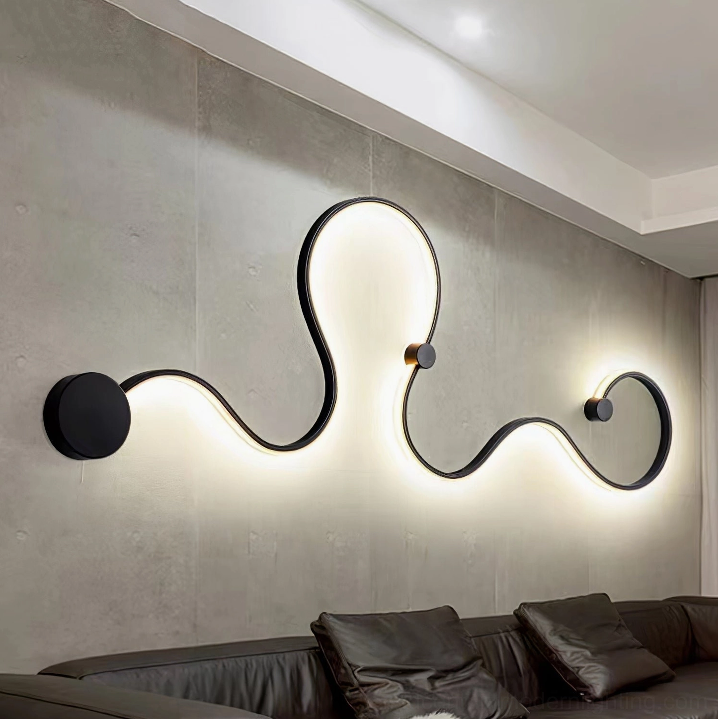 Style D snake wall lamp mounted in contemporary living space with minimalist interior design