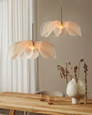 Dual Styria Petals pendant lamps in modern dining room with warm neutral tones and minimalist boho decor