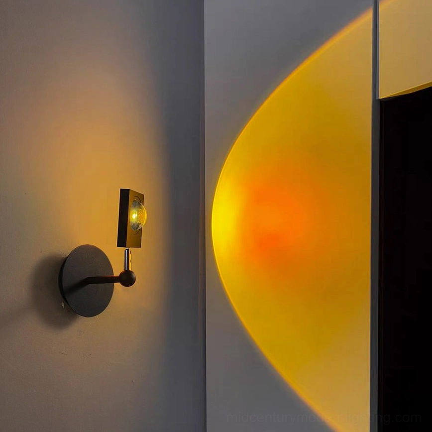 Sunset Halo side view with warm orange projection on dark gray hallway wall