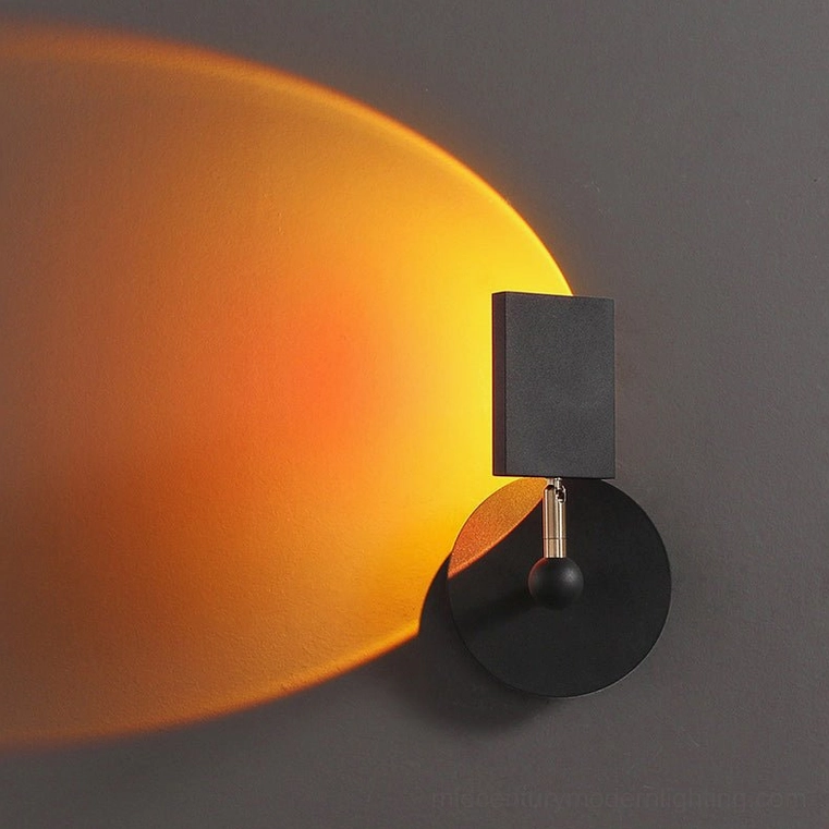 Sunset Halo projecting warm orange circular halo onto dark gray interior wall, side angle