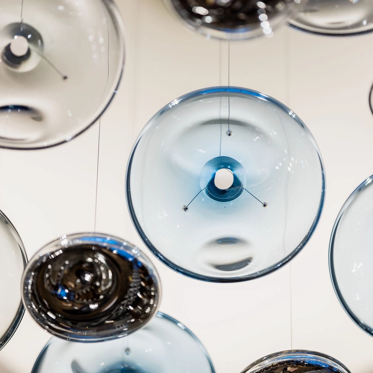 Surge Glass Cloud Chandelier single glass disc front close-up - blue-tinted glass sphere with integrated LED and metal mounting