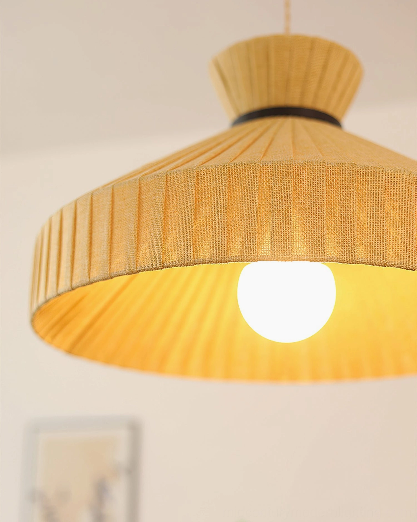 Surora pendant light design detail shot highlighting pleated fabric texture and warm neutral tones