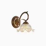 Sutton hand-blown glass wall sconce with antique bronze metalwork and ribbed clear glass shade - front view