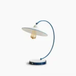 Swan Blue Table Lamp - Mid-century modern desk light with curved metal arm and cobalt blue enamel finish, studio flat lay view