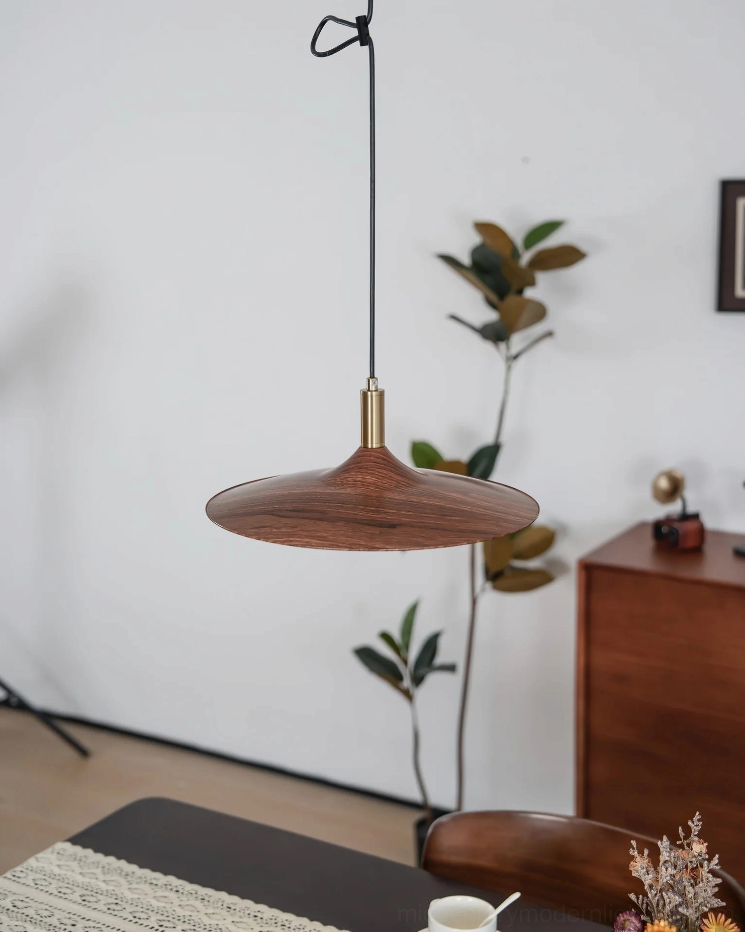 Wooden disc pendant light brass collar side view black hanging cord detail