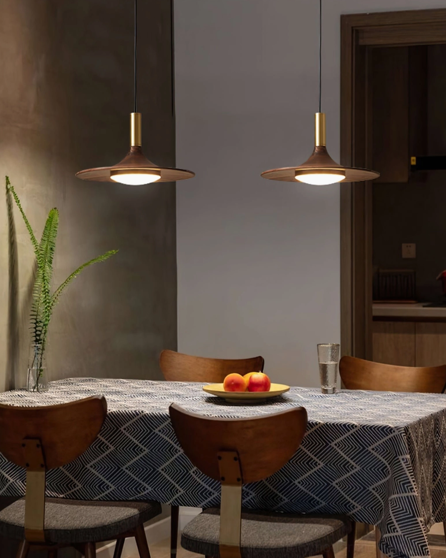 Multiple swing arm pendant lights installed formal family dining warm retro minimalist