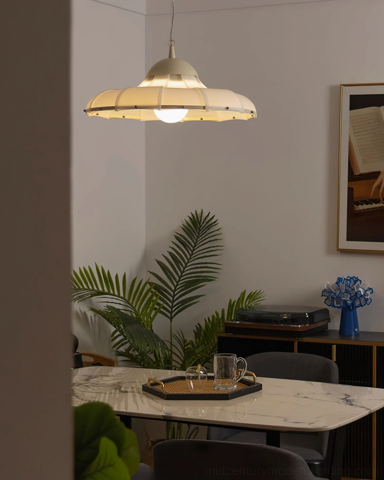 Swirl pendant lamp showcase highlighting scalloped milk-white shade and refined metal frame finish
