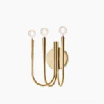 Swoop modern wall sconce with polished gold metal finish displayed against studio white background, showcasing sculptural curved arms and minimalist design