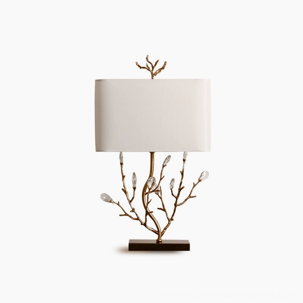 Compact overhead view of Sylvia brass branch table lamp with dark square base on minimalist white background