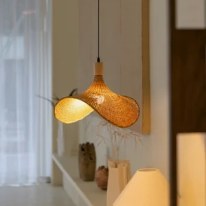 Taiga rattan pendant light three-quarter view in minimalist living interior with warm decor