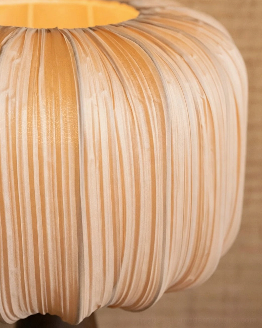 Close-up macro view of Talia lamp pleated fabric shade showing vertical ribs and soft illuminated texture detail