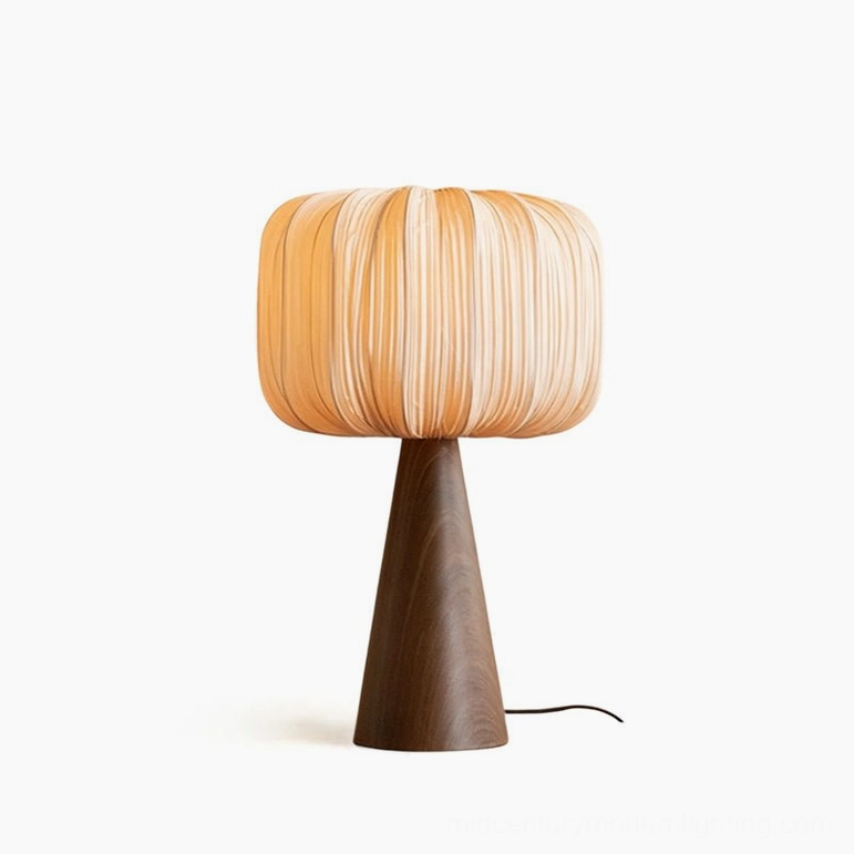 Talia pleated table lamp full frontal view with warm orange-toned ribbed beige shade and dark walnut wooden base