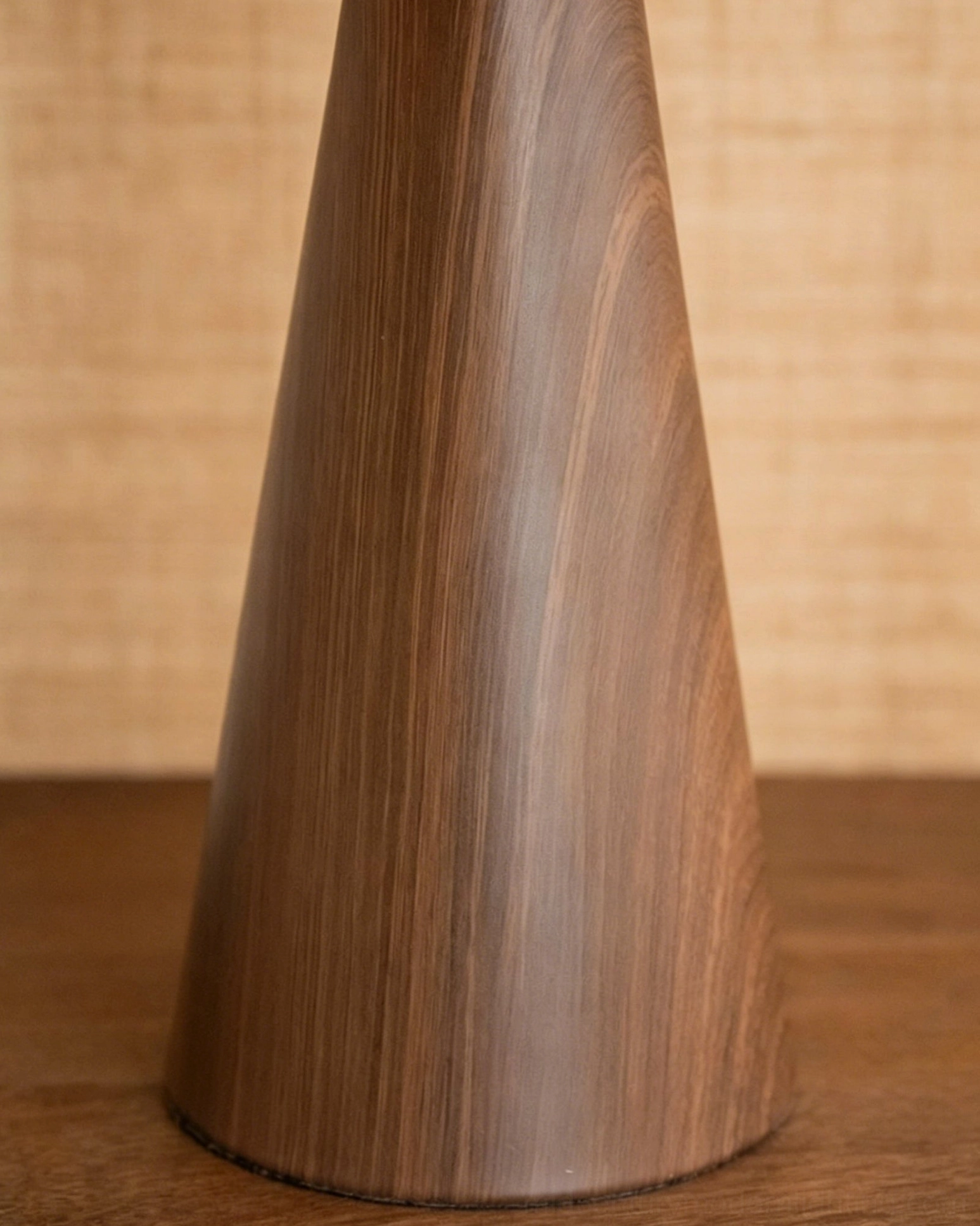 Close-up of Talia lamp walnut wood base showing tapered conical shape natural grain and smooth finish detail