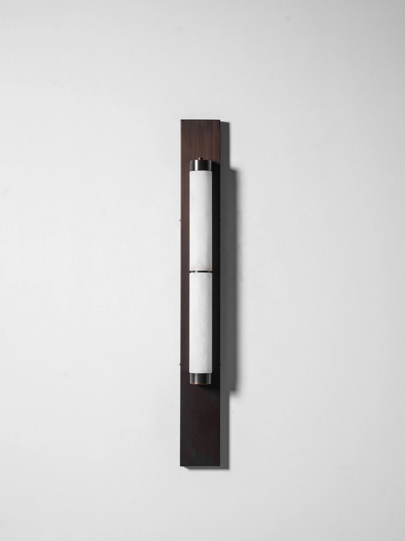 Tall statement alabaster wall sconce brass backplate white stone warm light professional