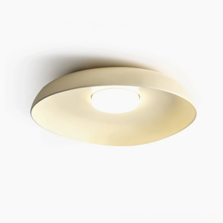 Tambo ceiling lamp in soft cream color, minimalist studio setting highlighting modern mid-century design aesthetic