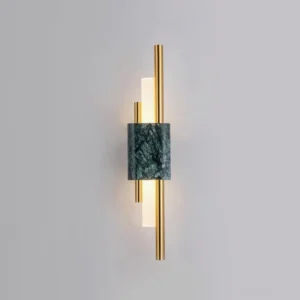 Tanto wall sconce with warm white LED light casting glow on light gray wall - ambient wall-mounted marble lighting fixture