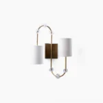 Tanyel twin-head wall sconce with brass frame and crystal accents, front view on white background