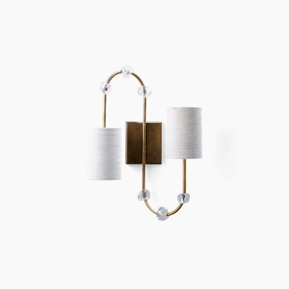Tanyel twin-head wall sconce with brass frame and crystal accents, front view on white background