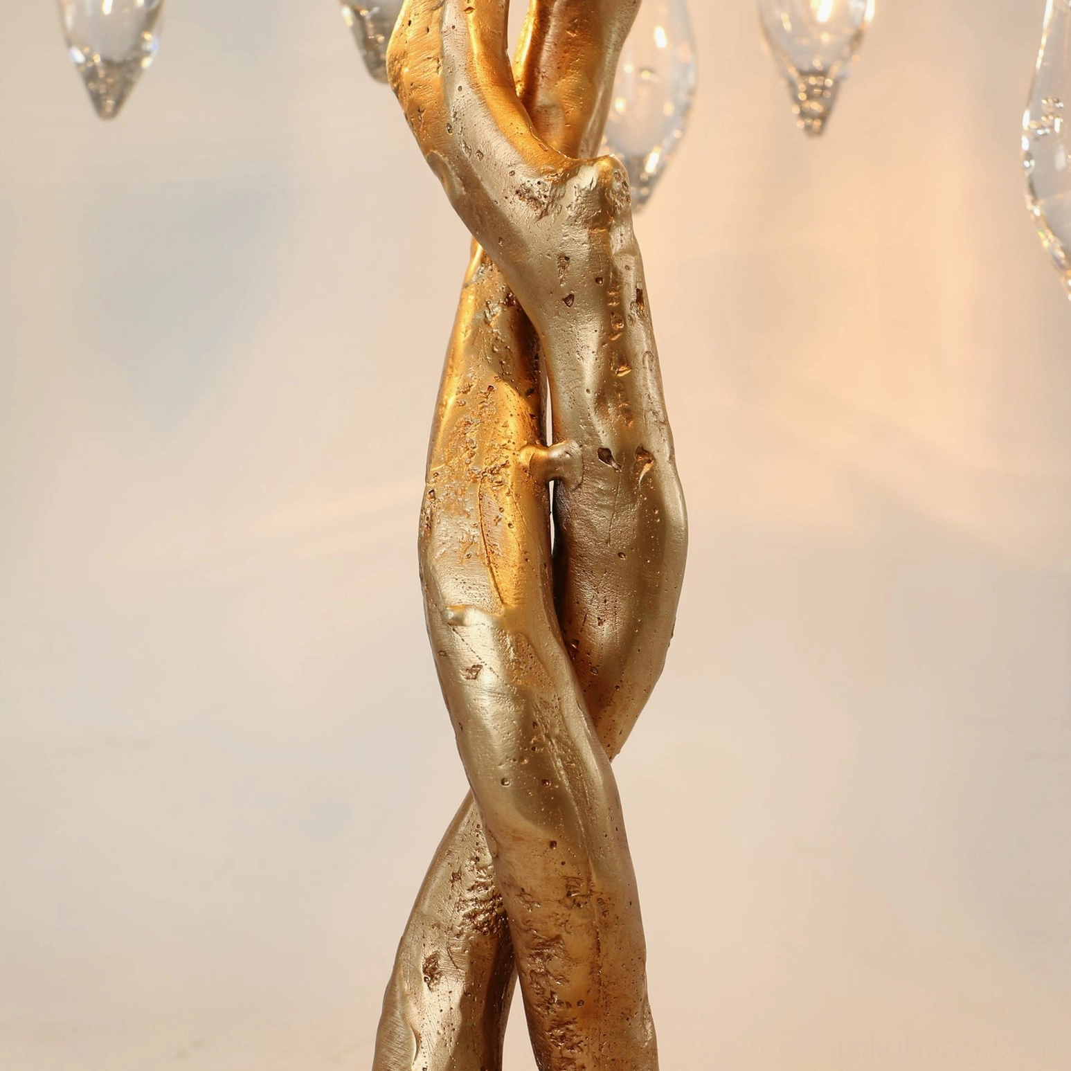 Overhead view of embossed carved gold metal base of Teardrop Branch Table Lamp showing craftsmanship