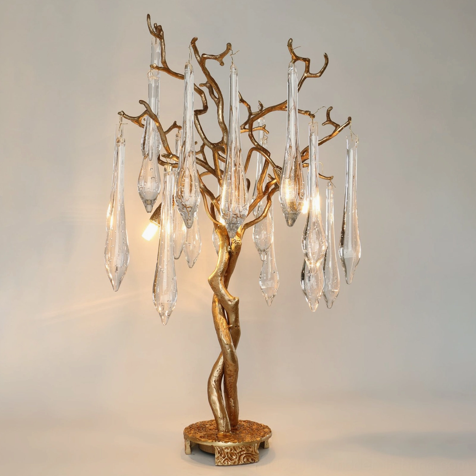 Fully illuminated Teardrop Branch Table Lamp front view with all LED lights active showing hanging glass teardrop ornaments