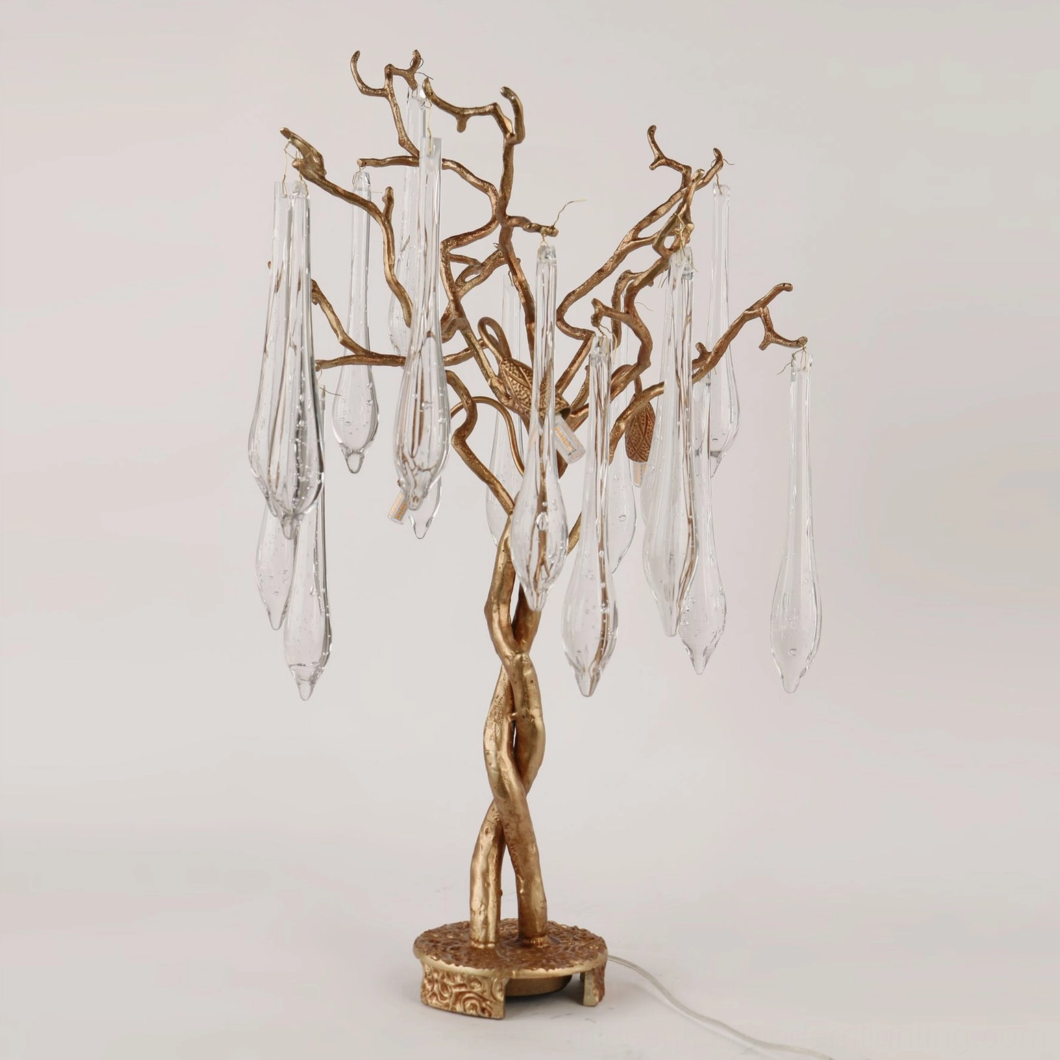 Side profile view of unlit Teardrop Branch Table Lamp showing twisted gold trunk frame and branch architecture