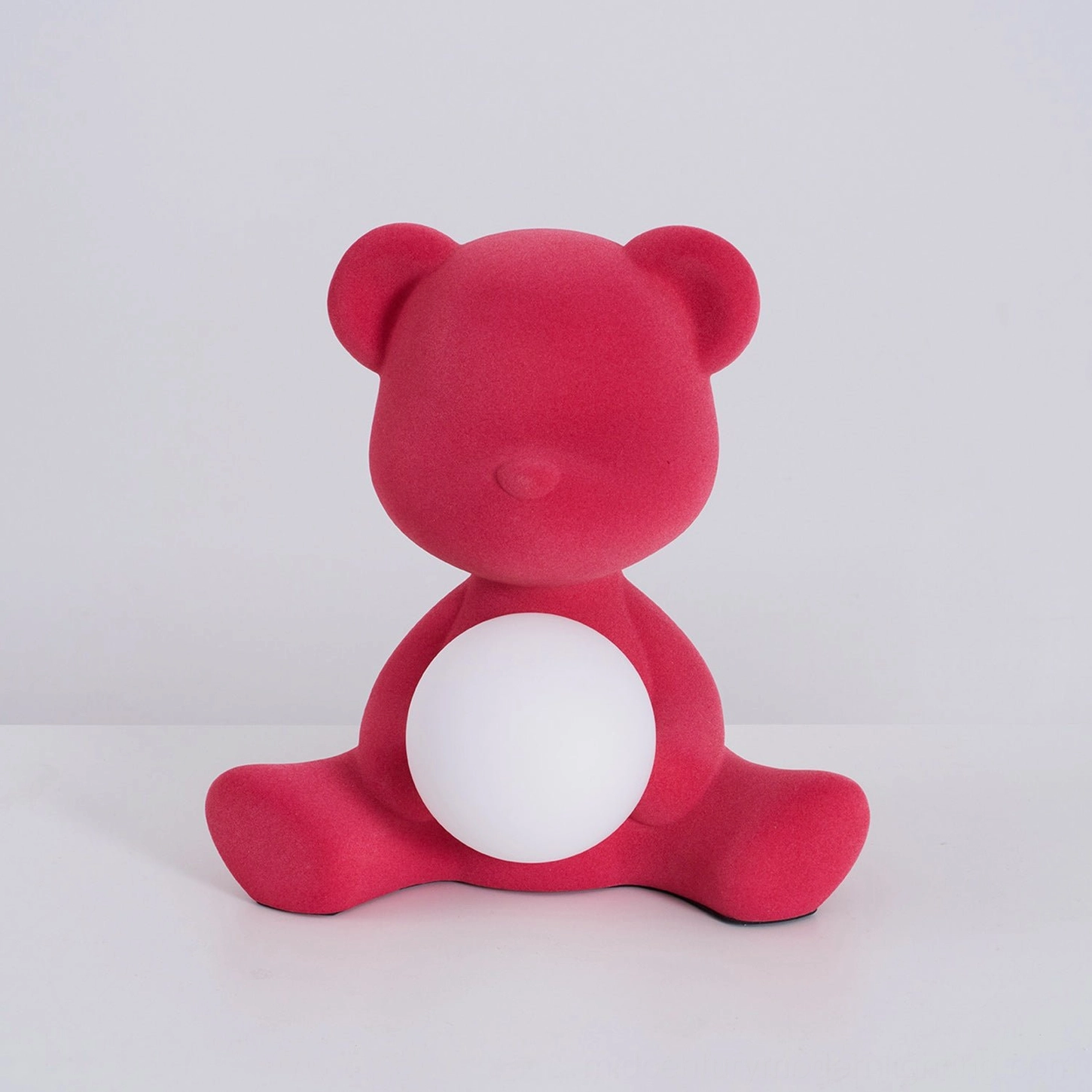 Teddy bear table lamp in package showing product protection and presentation