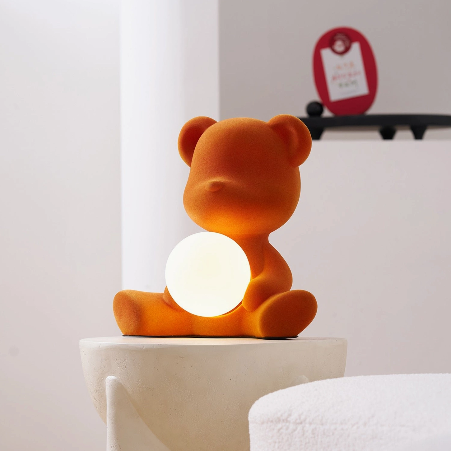 Teddy bear table lamp three-quarter view showing rounded silhouette and sitting bear design