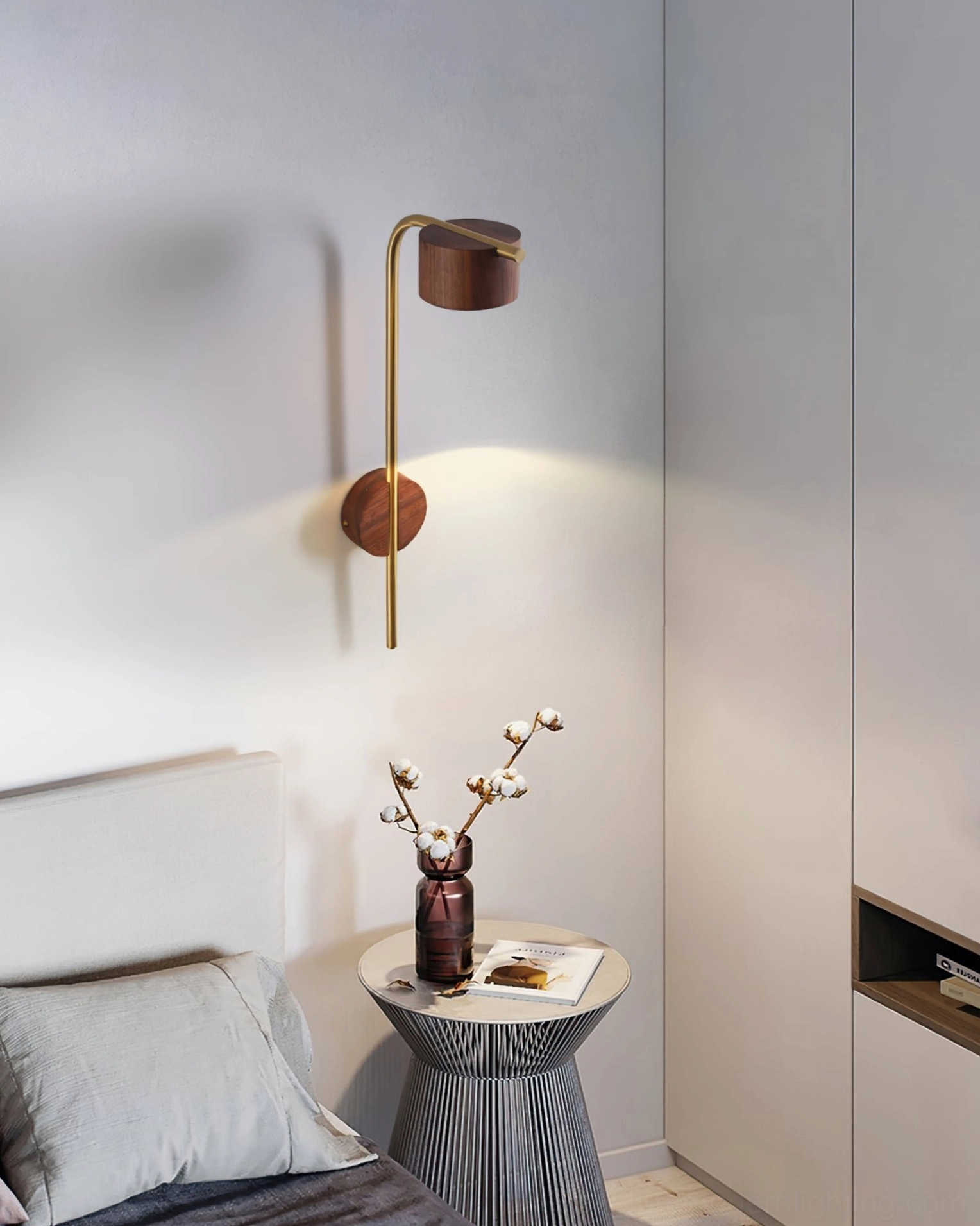 Terence wall light installed above bedroom nightstand with round side table, bedside reading setup