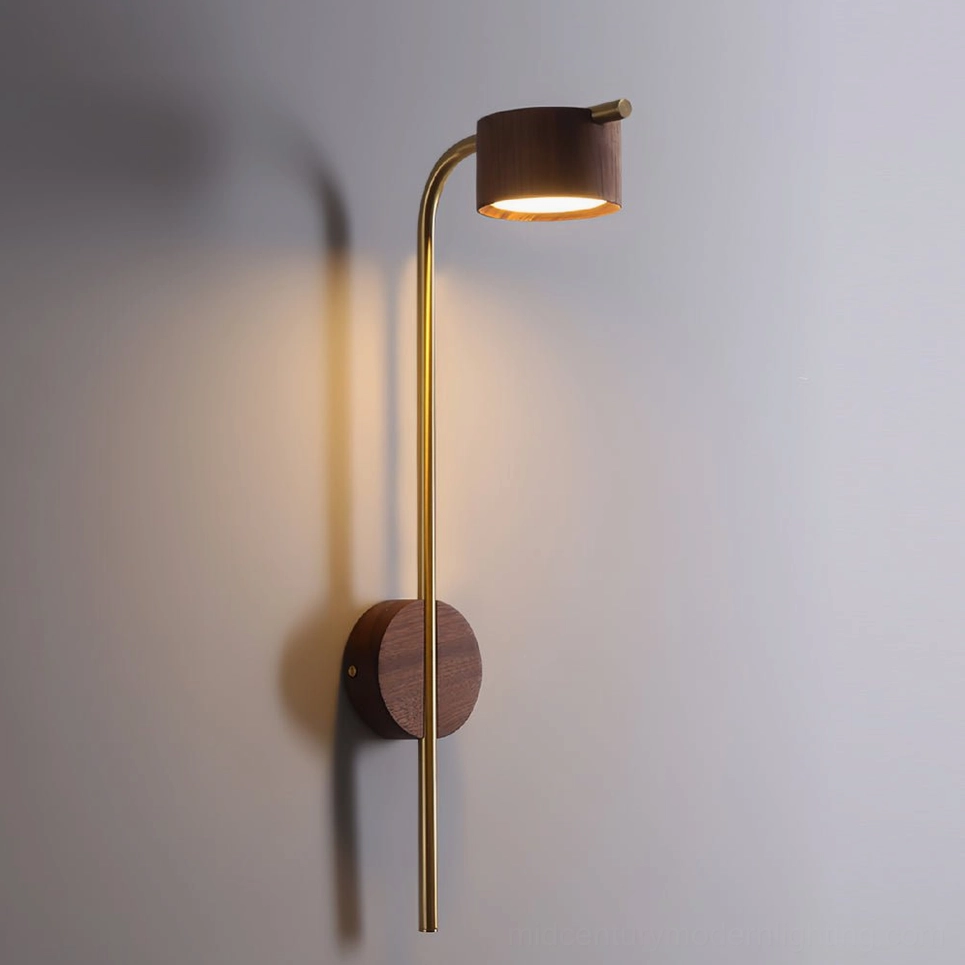 Mid-century modern wall sconce with curved brass arm and wooden head, side angle view